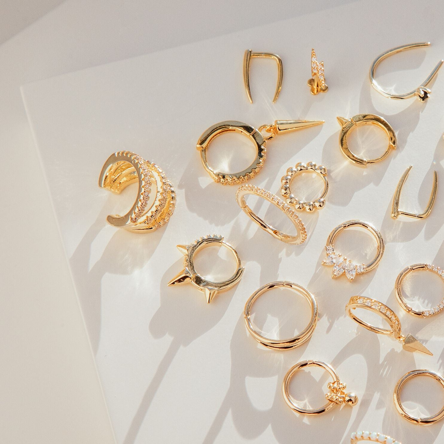gold huggie hoop earrings - Helix & Conch
