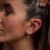 Celestial pair of gold star huggie hoop earrings - Helix & Conch
