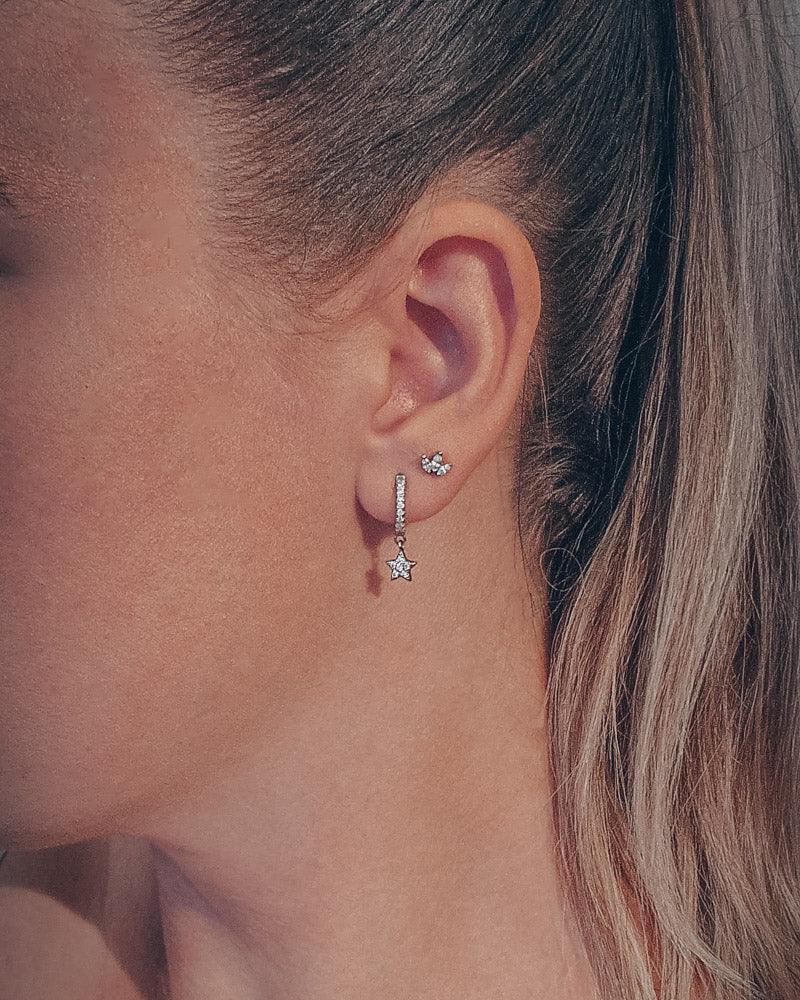 Celestial pair of white gold star huggie hoop earrings - Helix & Conch