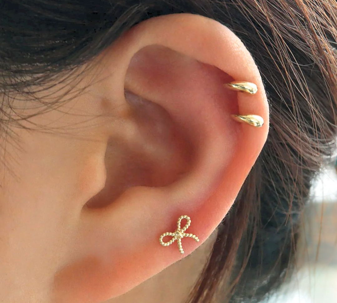 Gold Bow earring and gold internally threaded stud earring