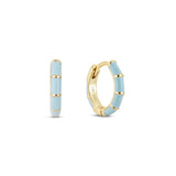 A pair of gold-plated huggie hoop earrings with blue enamel inlay, displayed against a white background.