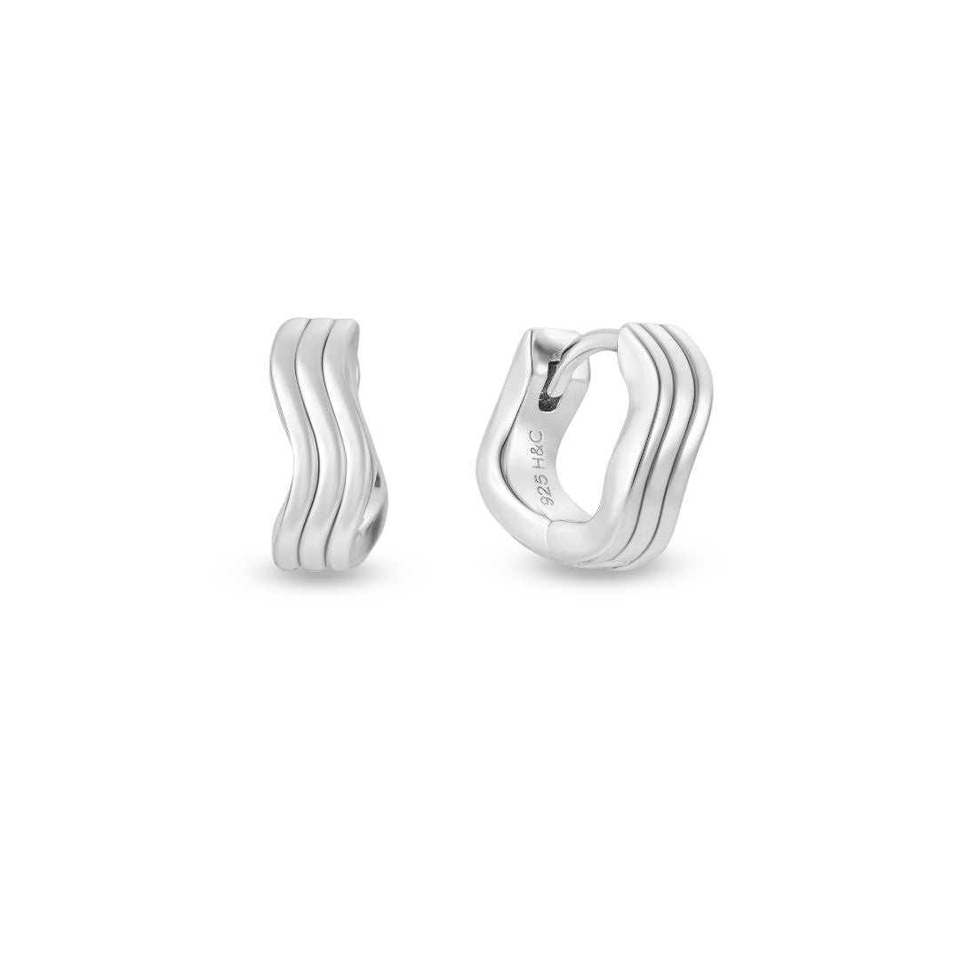 A pair of white gold plating over 925 sterling silver huggie hoop earrings with a wave design.