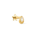 A pear shaped yellow gold stud earring with a bezel set crystal and milgrain detail, part of the Verso Collection.