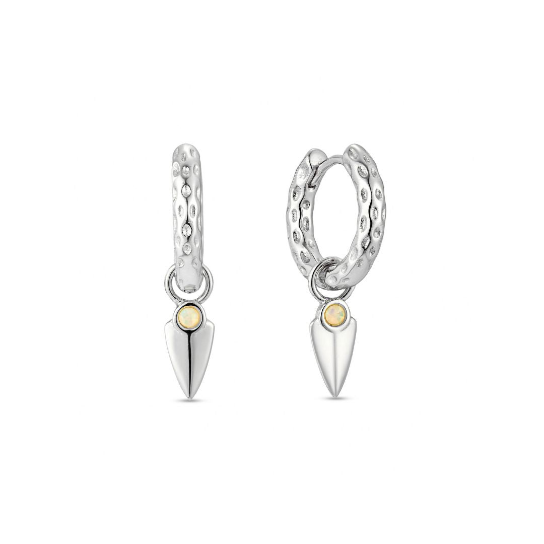 A white gold plated hoop earring with an opal charm attached to a hammer-textured hoop.