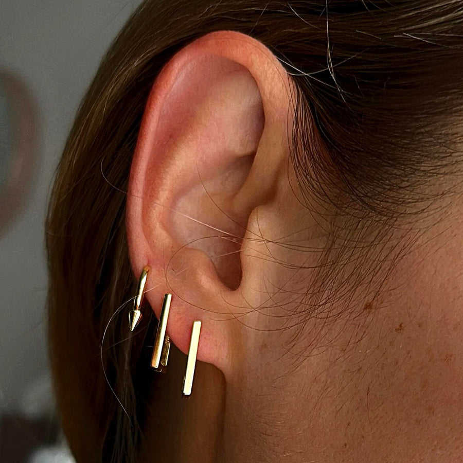 Conique gold spike huggie hoop earring