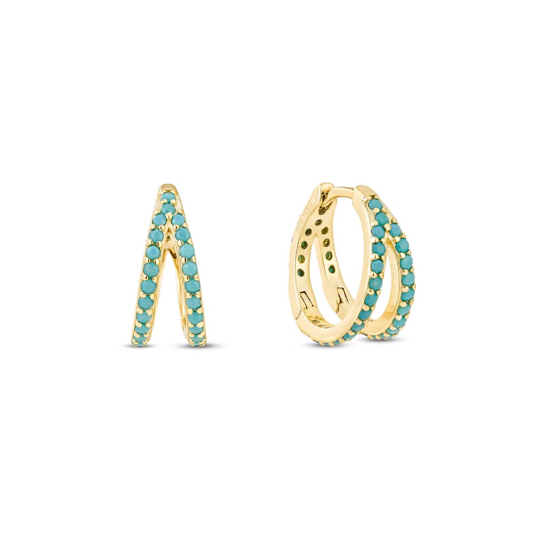 A pair of yellow gold plated hoop earrings with turquoise paving, designed to look like two separate hoop earrings.