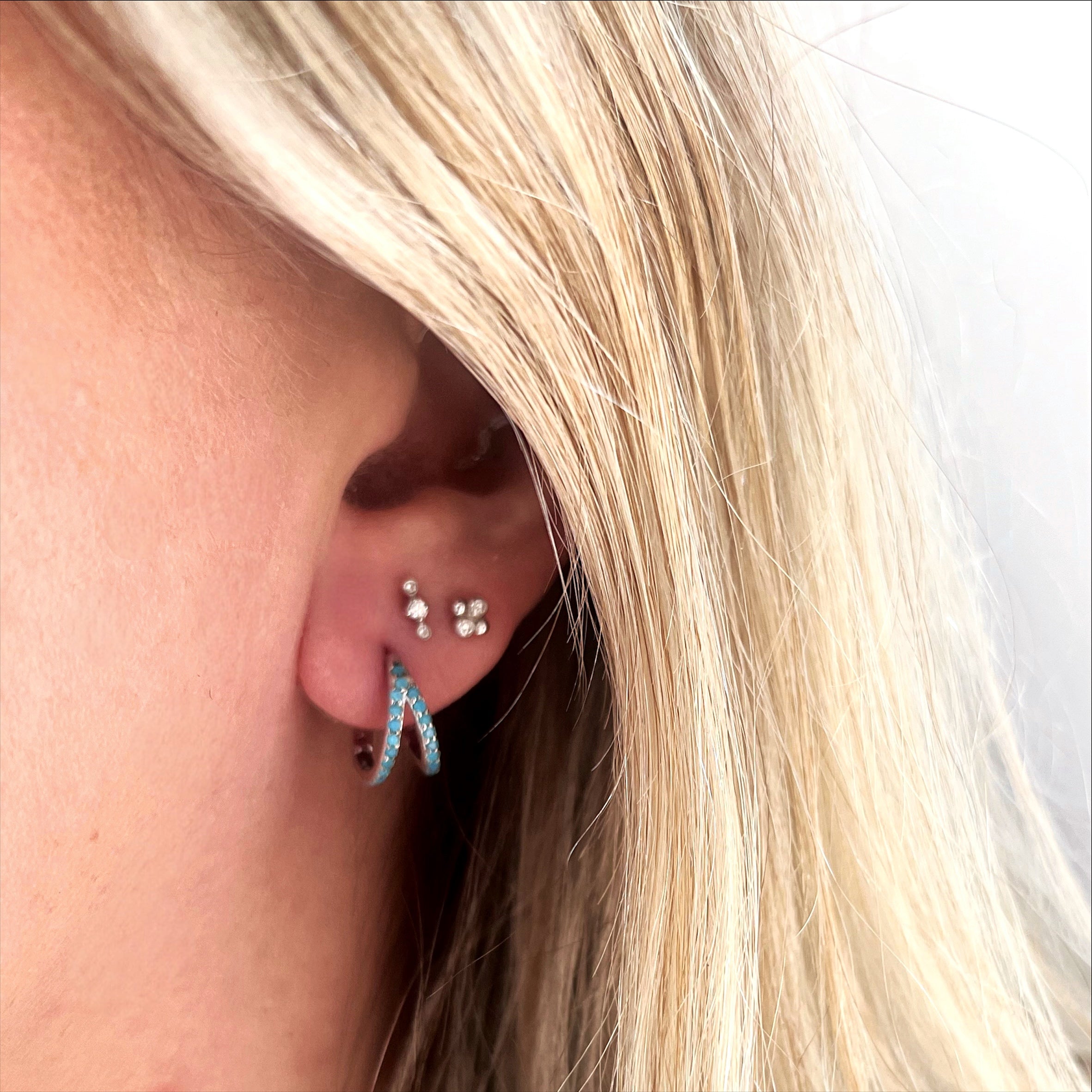 Laguna white gold and turquoise hoop in ear