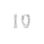 A pair of white gold rope huggie hoop earrings on a white background.