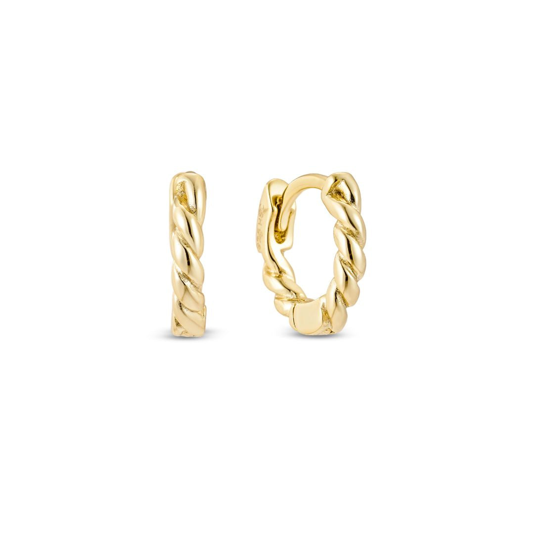 A pair of yellow gold rope huggie hoop earrings on a white background