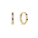 A single yellow gold plated hoop earring with deep sapphire cubic zirconia placed between gold beading.