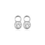 Pair of solid white gold earring charms with clear gemstones on a white background