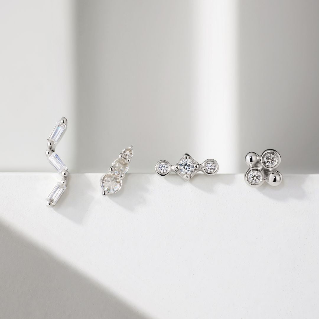 White gold flat back studs placed in a line