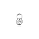 white gold earring charm with a clear gemstone on a white background