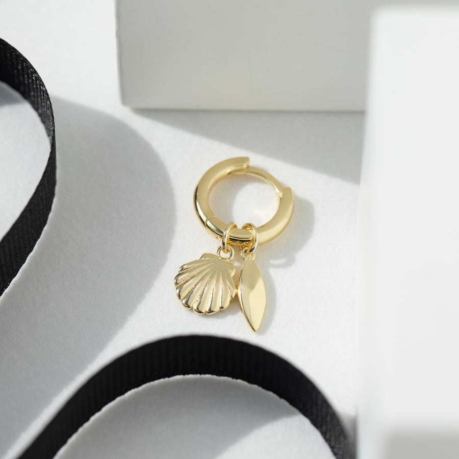 Fyra yellow gold huggie hoop single earring with detachable shell & leaf charm